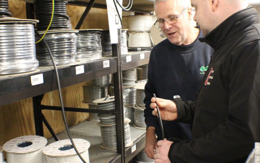  | Store Owner And Customer Discussing Cable Quality Web